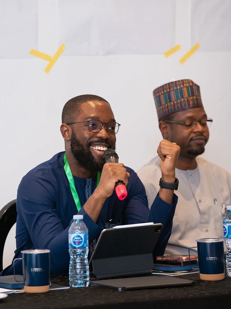 A colleague speaking during a workshop discussion
